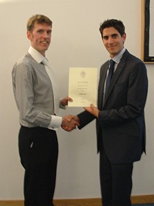 Ashley receives his certificate and cheque from James Wren (Prosig UK)